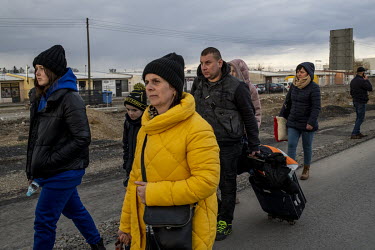 People fleeing the Russian invasion of Ukraine arrive on Polish soil after crossing the Medyka â�" Shehyni border point where many Poles and expatriate Ukrainians have also travelled with food, help...