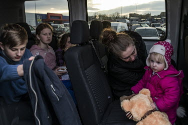 Mariana (middle), with her daughter, nieces and nephews, has just arrived from Bila Tserkva, some 90 km from Kiev. She is now going to Krakow in a private bus organised by volunteers who have come to...