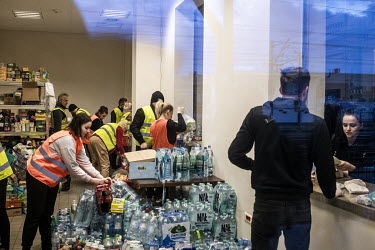 Polish and Ukrainian volunteers provide water, food and basic hygiene products to the refugees who have just arrived in Przemysl by train from Kiev (Kyiv) and Lvov (Lviv).