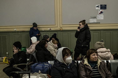 Refugees fleeing the Russian invasion of Ukraine rest in a reception centre at the main railway station in Przemysl.