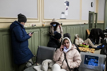Refugees fleeing the Russian invasion of Ukraine rest in a reception centre at the main railway station in Przemysl.
