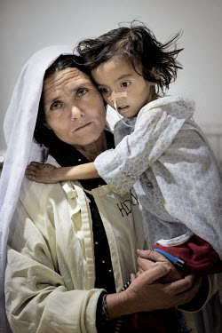 Sharifa with her daughter Momina who is undergoing medical treatment for severe acute malnutrition (SAM) at the provincial hospital in Bamiyan. She had been suffering from malnutrition for some time,...