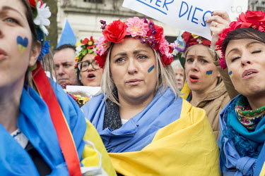 Women wearing flower garlands (vinok) stand in a crowd of Ukrainians from across northern England who gathered in Piccadilly Gardens in Manchester to stand in solidarity with Ukrainians in their homel...