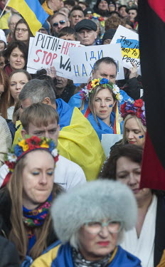 Women wearing flower garlands (vinok) stand in a crowd of Ukrainians from across northern England who gathered in Piccadilly Gardens in Manchester to stand in solidarity with Ukrainians in their homel...