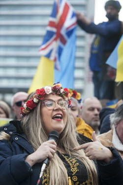 A woman wearing a flower garland (vinok) gives as speech as Ukrainians from across northern England gathered in Piccadilly Gardens in Manchester to stand in solidarity with Ukrainians in their homelan...