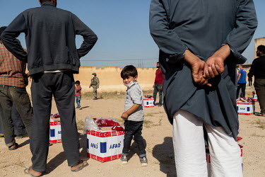 Bread and basic food parcels are distributed to people in Tabia village by staff working for AFAD (Disaster and Emergency Management Presidency), a Turkish NGO which, alongside the Turkish Red Crescen...