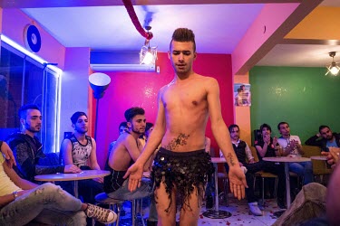 A dancer at a same-sex Syrian engagement party the 'My Dubai Cafe' in the city, performs to an audience of other LGBT refugees from Syria and Iraq. Muhammed Wisam Sankari, also a gay Syrian man (weari...