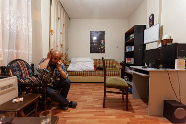 Mahmoud Hassino on the phone at home in Istanbul.  After leaving Damascus, Mahmoud lived in Turkey for around three years, from where he worked as a journalist covering the conflict in his native Syri...
