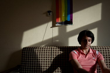 Dani (23) from Tehran, Iran. Discussing his situation and life in Iran, Dani sits under a poster advertising the Istanbul Pride event. Life for Dani was difficult in the Islamic Republic, although he...