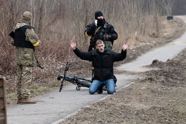 A man is arrested and questioned after cycling from Irpin to Kiev (Kyiv) as residents continue to try and evacuate the suburb that has been heavily bombed by invading Russian forces.