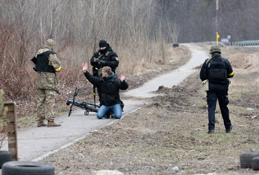 A man is arrested and questioned after cycling from Irpin to Kiev (Kyiv) as residents continue to try and evacuate the suburb that has been heavily bombed by invading Russian forces.