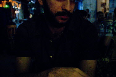 Abdul at a cafe in Souq Sarouja, central Damascus.  Originally from Baghdad, Iraq, he was forced to flee the country due to reasons, and threats, connected with his homosexuality.  From Syria Abdul ap...