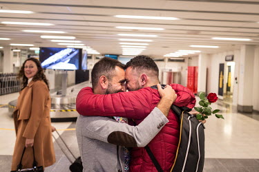 After months apart, Omar (right) and Nader (left) are reunited at Bergen airport, Norway. Nader proposed to Omar at his birthday party, shortly before being resettled to Norway, at which point it was...