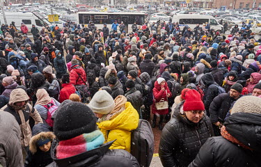 Thousands of people, waiting as snow falls, for hours at the station for the humanitarian train to Lviv. Most of the the crowd are from Dnipro while others are from Kharkiv, Mariupol and Volnovakha.