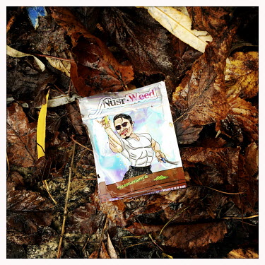 A discarded empty plastic drug 'baggie' used for for weed and featuring a cartoon motif.