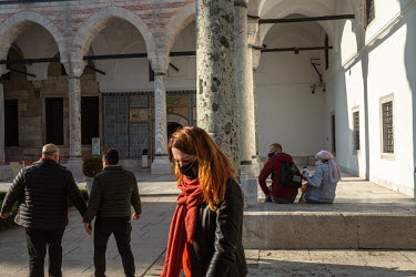 Foreign tourists take a selfie outside the Topkapi Palace, during a nationwide weekend coronavirus curfew which didn't apply to overseas visitors.