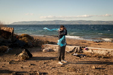 An Afghan man stands on a beach near Molyvos after just arriving from Turkey on a rubber dinghy.