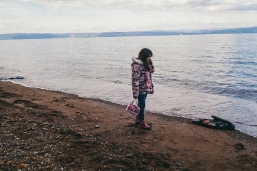A Syrian girl on a beach near Molyvos. She just arrived from Turkey on a rubber dinghy wearing her favourite clothes, all in matching pink.