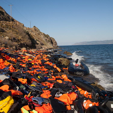 A large pile of discarded life vests used by informal migrants who recently smuggled themselves across the Aegean Sea from mainland Turkey to Greece.