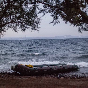 A discarded rubber dingy used by informal migrants who recently smuggled themselves across the Aegean Sea from mainland Turkey to Greece.