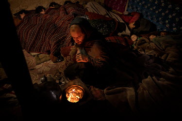In a house built of mud walls and with a roof made of old plastic, Faiz Mahamad lives with his wife, sister-in-law and a total of 13 children. The family fled the war in Helmand and now survives by co...
