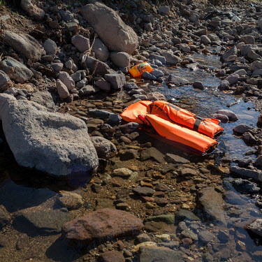 A discarded life vest used by informal migrants who recently smuggled themselves across the Aegean Sea from mainland Turkey to Greece.