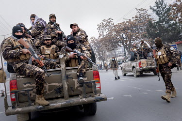 A Taliban fighter-squad patrol the streets of Kabul.