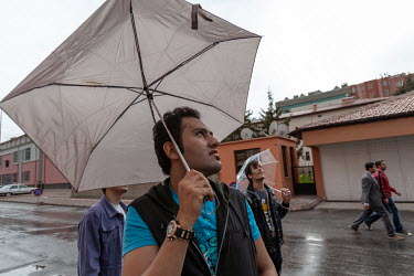 Arsham, in the foreground, and Arash behind him, look into the sky on a rainy day in Kayseri. A conservative business hub, Kayseri is home to many Iranian LGBT asylum seekers, with some complaining of...
