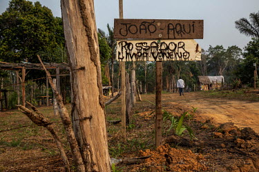A sign marking a plot of land in the Terra Prometida camp, an area of rural land invaded by squatters.