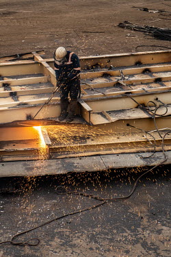 A welder working in the Aliaga ship-breaking yard.