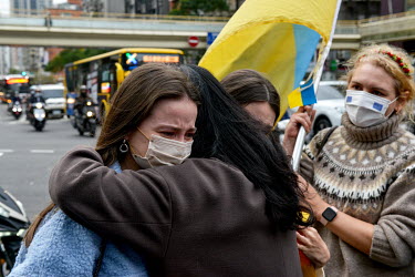 Women console each other during a pro-Ukraine rally held outside the Russian representative office following the news that overnight president Putin had ordered a full-scale invasion of Ukraine.