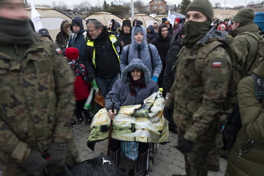 Polish soldiers assisting refugees at the border. As Russian and Ukrainian forces continue to engage in combat, millions of women, children and the elderly have poured out of Ukraine to seek refuge in...
