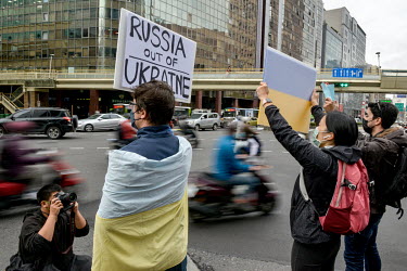 People at a pro-Ukraine rally held outside the Russian representative office following the news that overnight president Putin had ordered a full-scale invasion of Ukraine.