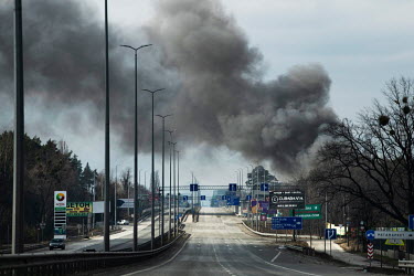 A thick plume of smoke rises near the main E40 highway at Stoyanka from Kyiv, looking west to Poland and the Belarus border. It is now no longer secure, with several towns to the north of this directl...