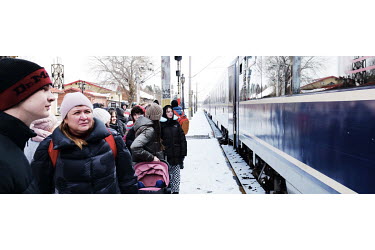 Ukrainian refugees board a train at Suceava's station which will take them directly to Bucharest.