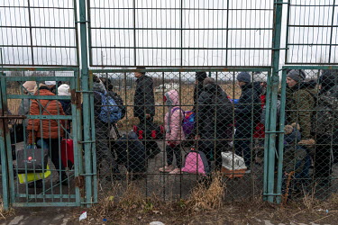Ukrainian refugees, primarily women, children and the elderly, fleeing Russia's invasion of the country, queue for hours at the Medyka-Shehyni border crossing with Poland to reach safety.