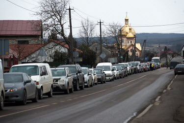 A long queue of traffic as Ukrainian refugees, primarily women, children and the elderly, fleeing Russia's invasion of the country, queue for hours at the Medyka-Shehyni border crossing with Poland to...