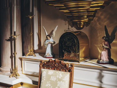 Statues of angels watch over the altar in the Ermita de la Virgen de Criptana, a church on the outskirts of Campo de Criptana.