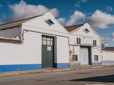Two warehouses in contrasting states of repair in Campo de Criptana.
