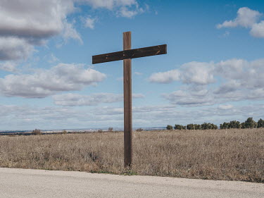 One of a series of large, wooden crucifixes that line the CM-3105, a road leading into Campo de Criptana.
