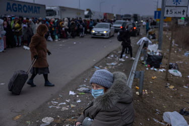 Refugees by the millions are fleeing Ukraine, most of them to Poland as these people on the Krakovetz border cross. Mostly woman and children arrive here by car or busses and stand in lines in the fre...