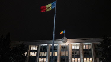 Moldovan flags fly over a government institution.