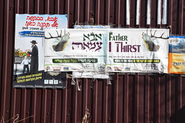 Religious posters in English and Hebrew.