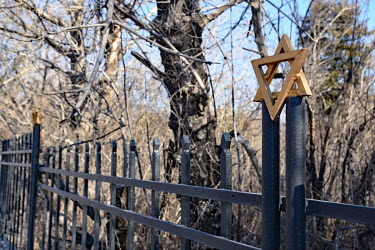 A Star of David symbol on a fence in the old Jewish cemetery.