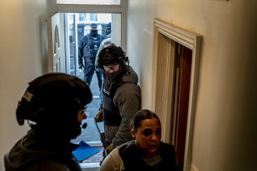 Detective Constable Chloe Wilson (right) leads a raid on an address in London by the Modern Slavery Team.