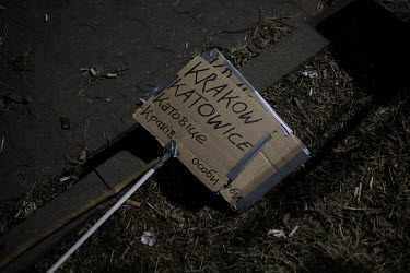 A sign indicates transport to Krakow and Katowice lies on the ground outside an old Tesco supermarket building, which has been converted into a humanitarian aid centre. It is here that Ukrainian refug...
