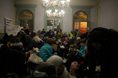 Ukrainian refugees wait in a crowded Przemysl train station.