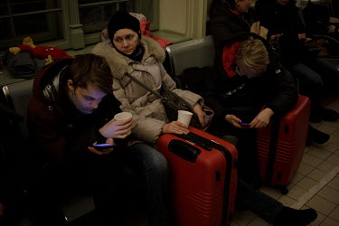 Ukrainian refugees wait at Przemysl train station.