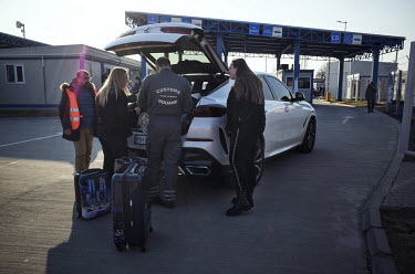 Customs police check the cars of refugees coming from Ukraine.