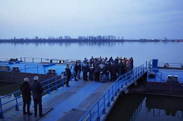 Romanian Prime Minister Nicolae Ciuca and local autorities surrounded by the press during a visit to the Isaccea entry point, where thousands of Ukrainian refugees have arrived fleeing the war.